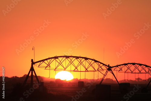 Irrigation System silhouette at Sunset with a colorful sky south of Lyons Kansas USA.