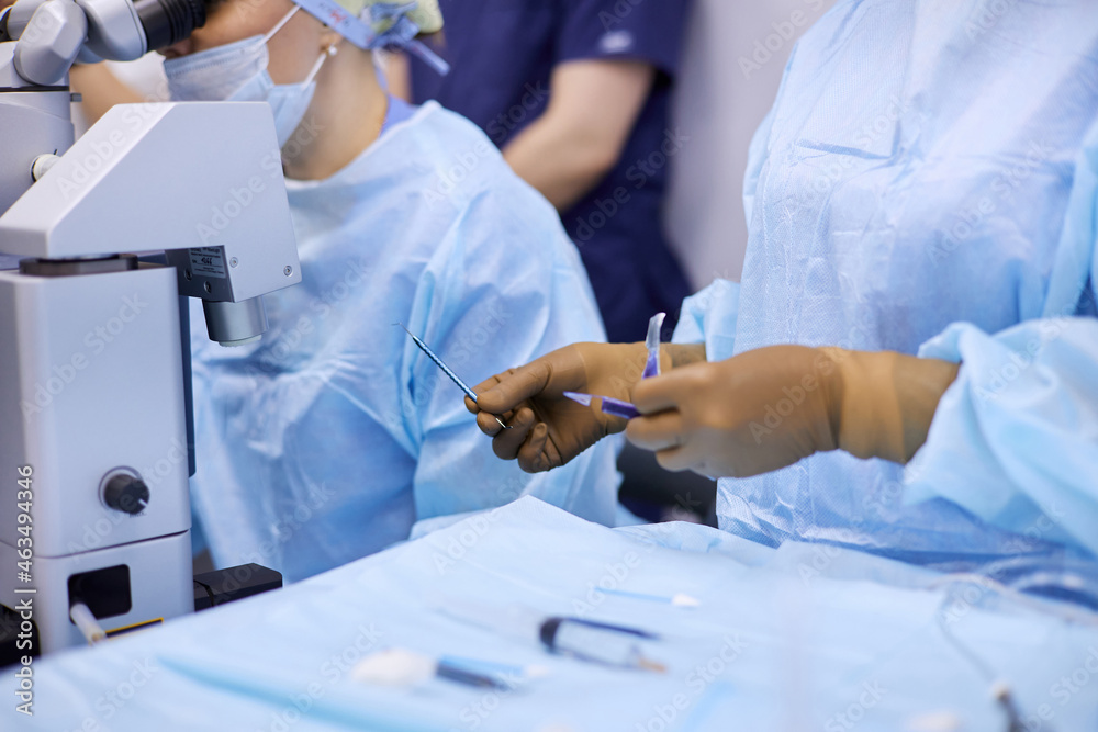 Surgeons performing eye surgery in the operating room Surgeons performing eye surgery in the operating room