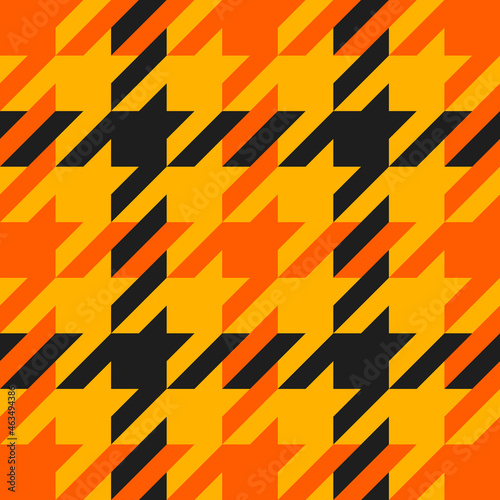 Goose foot. Halloween Pattern of crow's feet in orange, black and yellow cage. Glen plaid. Houndstooth tartan tweed. Dogs tooth. Scottish cage. Seamless fabric texture. Vector illustration