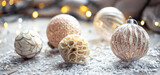 Festive background with Christmas balls and blurred bokeh lights.