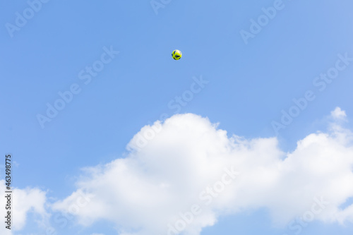 a soccer ball kicked in the blue sky in autumn  showa kinen park, tachikawa city