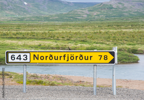 Sign near the road pointing towards village of Nordurfjordur in Icleand photo