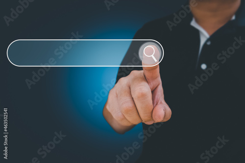 Man point on searching for data Information networking Concept, Business man clicking internet search page touch screen,copy space. data search technology search engine optimization.