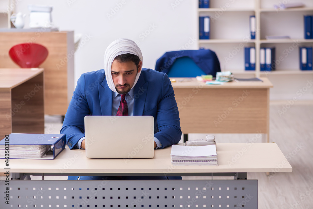 Young male employee suffering from toothache at workplace Young male employee suffering from toothache at workplace