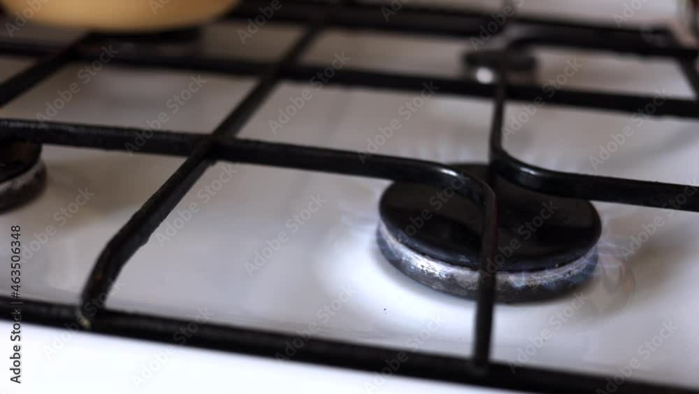 Gas Burner On The White Stove In The Kitchen. Dolly Slider Shot. Gas Burner On The White Stove In The Kitchen. Dolly Slider Shot.