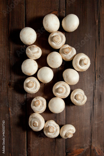 Mushrooms on a brown wooden background. Table top view 