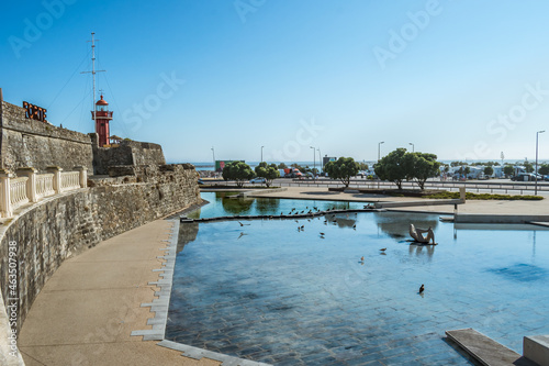 Perspective of the wall of the Santa Catarina fort with a small lake and birds in Figueira da Foz, PORTUGAL photo