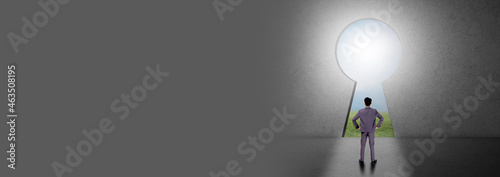 Fotografia Achievement of goal for successful, businessman standing and planning with idea and strategy for target of success, ambition and discovery with entrance keyhole for access, business concepts