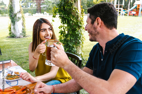 latin couple eating tacos and mexican food at outdoor Restaurant terrace in Mexico Latin America 