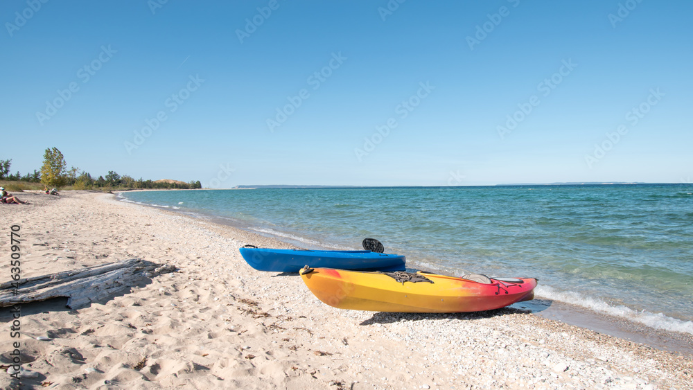 Kayaks on the beach at Sleeping Bear Bay, Michigan.