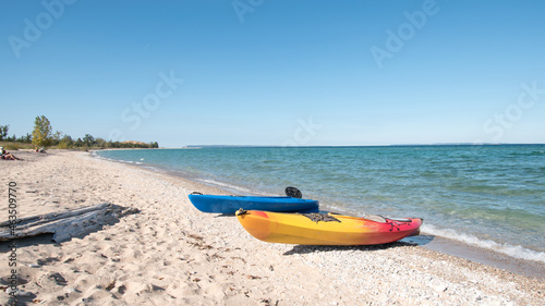 Fototapeta Naklejka Na Ścianę i Meble -  Kayaks on the beach at Sleeping Bear Bay, Michigan.