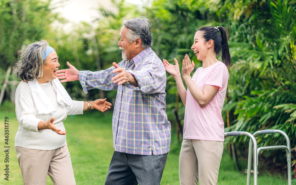 Portrait enjoy happy smiling love multi-generation asian family.Senior mature father and elderly mother with young adult woman walking outdoor in park at home.insurance concept Portrait enjoy happy smiling love multi-generation asian family.Senior mature father and elderly mother with young adult woman walking outdoor in park at home.insurance concept
