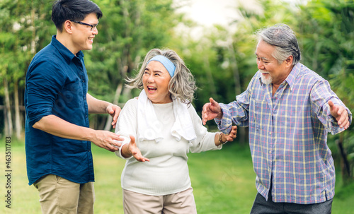 Portrait enjoy happy smiling love multi-generation asian family.Senior mature father and elderly mother with young son adult man walking outdoor in park at home.insurance concept © Art_Photo