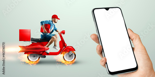 Smartphone in hand and fast delivery man on a red scooter. Delivery concept, online order, food delivery, last mile, banner, template. photo