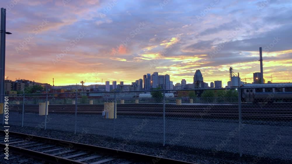 Abandon railway yard with Montrail skyline and a golden sunset fading in the background Abandon railway yard with Montrail skyline and a golden sunset fading in the background