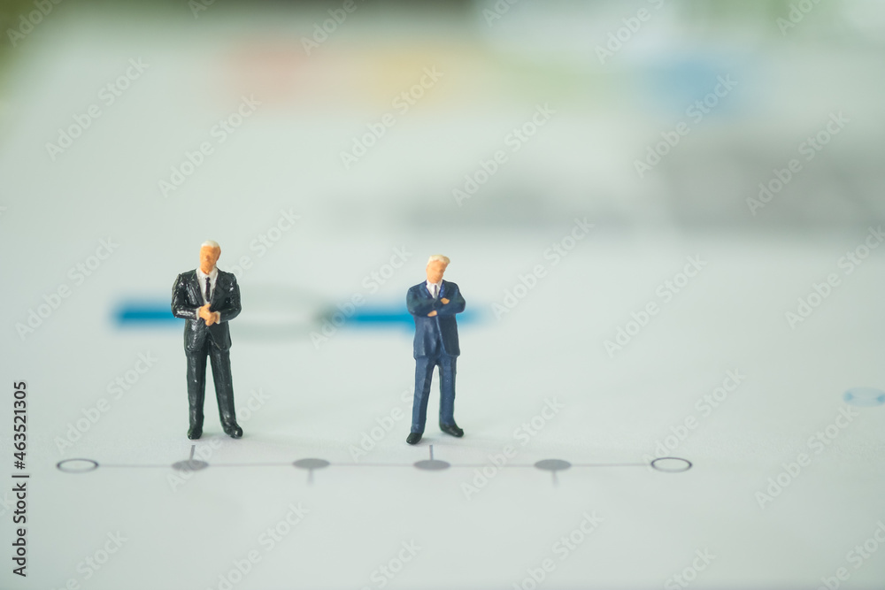 Miniature people businessman stand on a business horizontal timeline process chart. Miniature people businessman stand on a business horizontal timeline process chart.