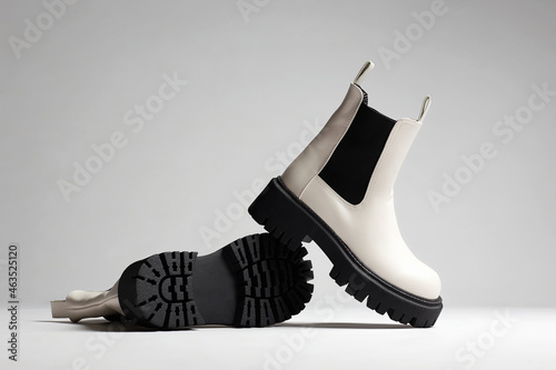 White Trendy boots. fashion female shoes still life photo