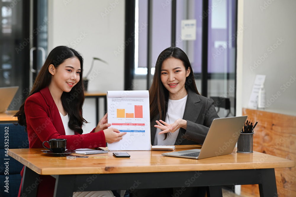 Two businesswoman presenting new strategy during video conference with her business partner. Two businesswoman presenting new strategy during video conference with her business partner.