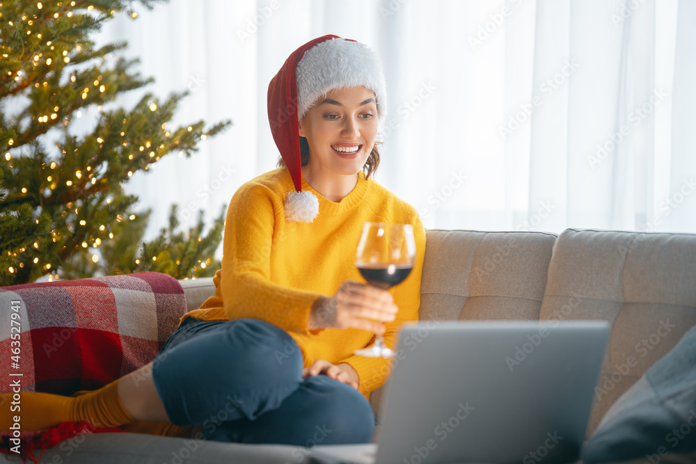 Woman in the livingroom decorated for Christmas