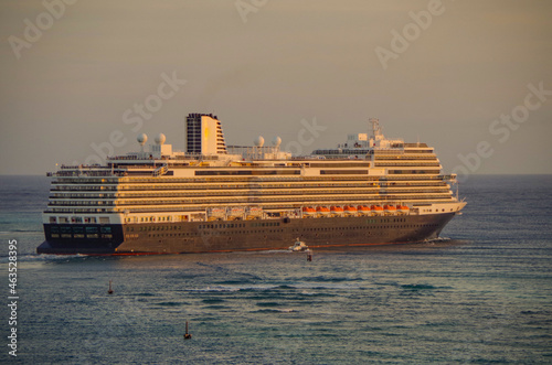 Huge modern HAL Holland America cruiseship or cruise ship liner departure from Oranjestad, Aruba cruise port for Caribbean cruising on holiday vacation	 photo