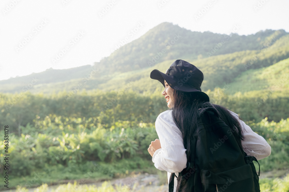 A young tourist girl adventures in a mountain forest. A young tourist girl adventures in a mountain forest.