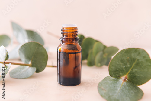 Fototapeta Naklejka Na Ścianę i Meble -  Bottle of eucalyptus essential oil on light background