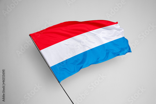 Luxembourg flag isolated on white background. close up waving flag of Luxembourg. flag symbols of Luxembourg. Concept of Luxembourg.