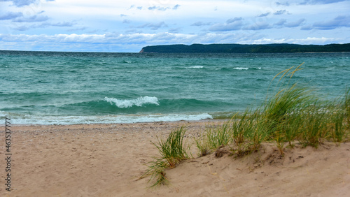 a stunning view across the turquoise-colored water of lake michigan  from the beach at sleeping  bear point in sleeping bear dunes national lakeshore in the lower peninsula of michigan