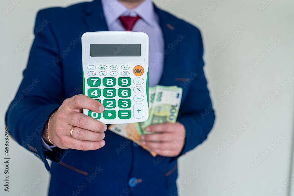 business man hold euro money and calculator business man hold euro money and calculator