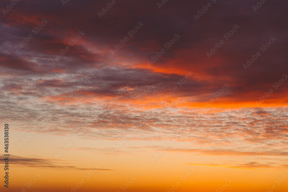 Sunset Cloudy Sky With Clouds. Sunset Sky Natural Background. Dramatic Sky. Sunset In Yellow, Orange, Pink Colors
