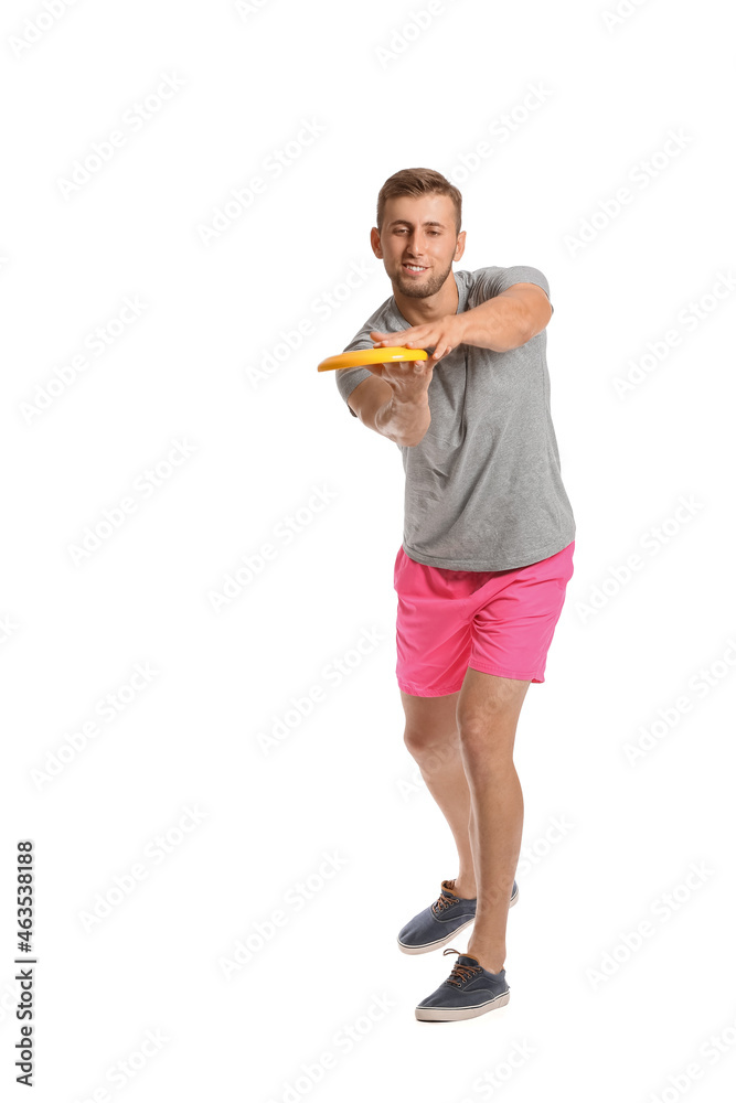 Handsome young man throwing frisbee on white background Handsome young man throwing frisbee on white background