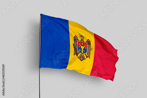 Moldova flag isolated on the blue sky background. close up waving flag of Moldova. flag symbols of Moldova. Concept of Moldova.