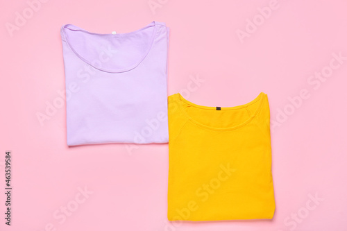 Stylish t-shirts on pink background