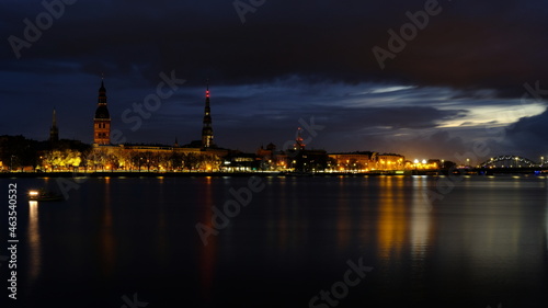 Autumn sunrise in Riga reflection of night lights in the Daugava