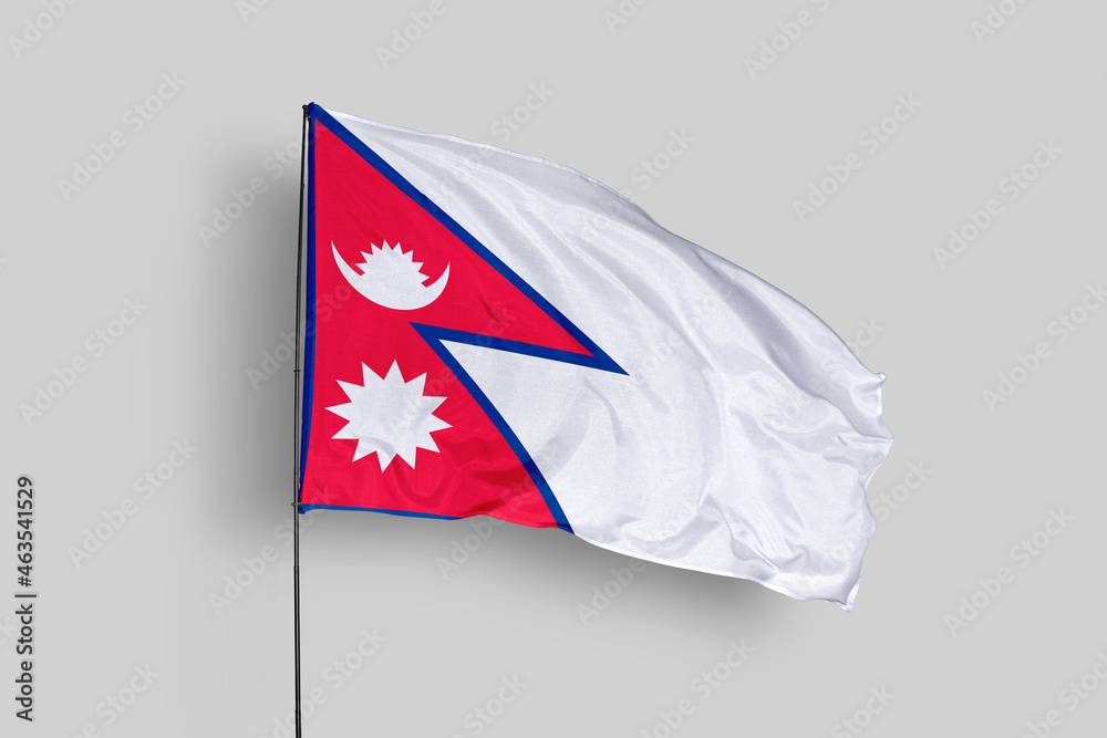 Nepal flag isolated on the blue sky background. close up waving flag of