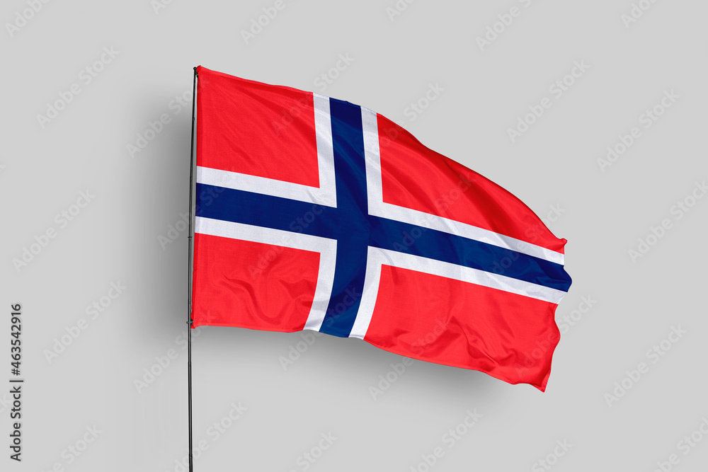 Obraz premium Norway flag isolated on the blue sky background. close up waving flag of Norway. flag symbols of Angola. Concept of Norway.