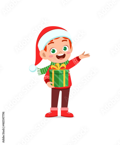 happy little boy holding present for christmas