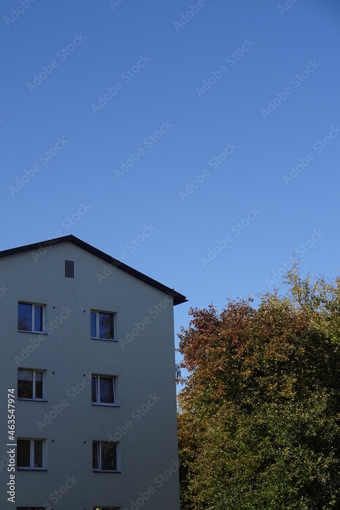 Close up of the house with clear blue sky background with an autumn foliage on the back. Pelgulinna, Tallinn, Estonia, Europe. September 2021