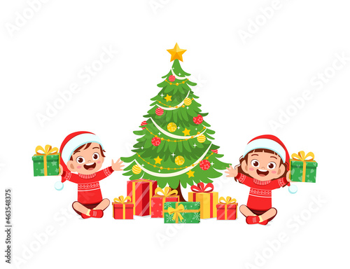 happy little boy and girl holding present for christmas