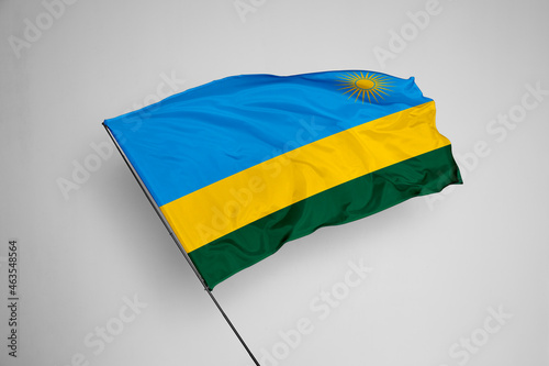 Rwanda flag isolated on white background. close up waving flag of Rwanda. flag symbols of Rwanda. Concept of Rwanda.