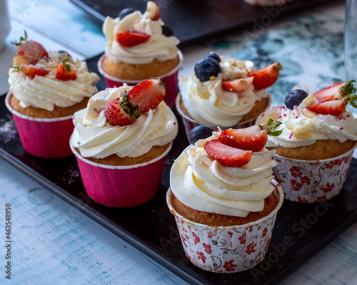 Muffins with strawberries in baking dish. top view. High quality photo
