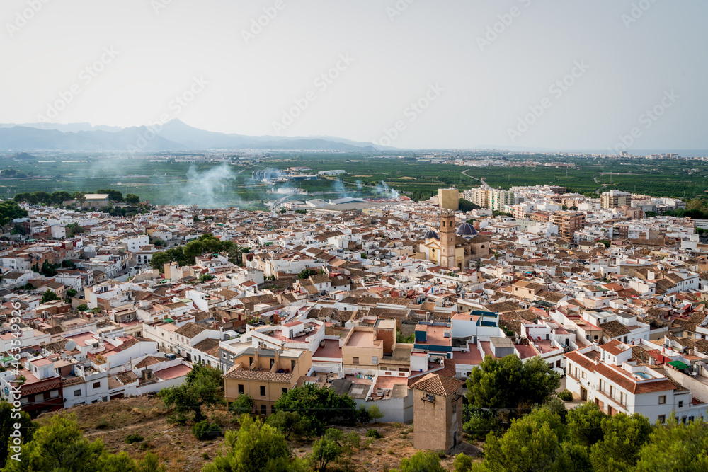 Aerial view from the castle 'Santa Anna' on the Spanish old town with the church 'San Roque', Oliva, Spain