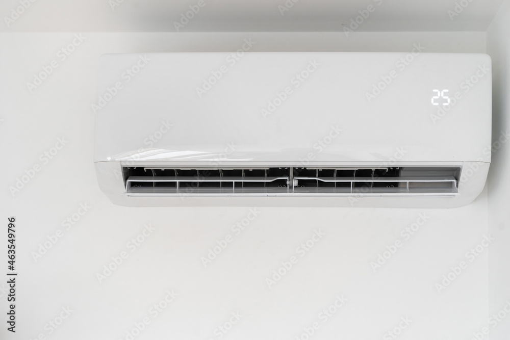 New air conditioner on white copy space wall New air conditioner on white copy space wall