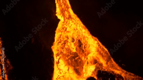 lava fountain in hawaii flowing down cone photo