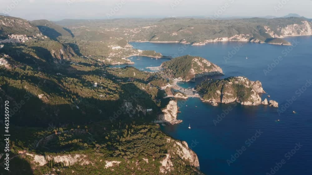 Drone view of Corfu Island, Greece flying sideways. Rocks, mountains, beach, ionian sea, Monastery Paleokastritsa is visible. High quality Prores LT footage. Drone view of Corfu Island, Greece flying sideways. Rocks, mountains, beach, ionian sea, Monastery Paleokastritsa is visible. High quality Prores LT footage.