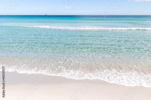 Fototapeta Naklejka Na Ścianę i Meble -  White empty beach landscape. La Cinta, San Teodoro, Sardegna, Italy. Blue sky, clouds