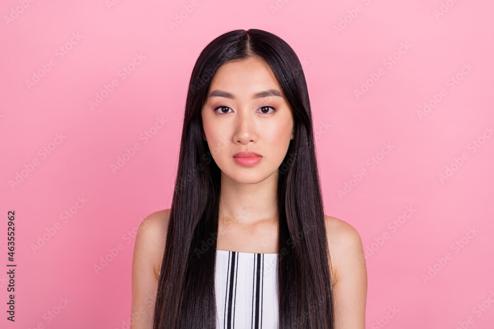 Photo of millennial nice brunette lady wear white overall isolated on pink color background Photo of millennial nice brunette lady wear white overall isolated on pink color background