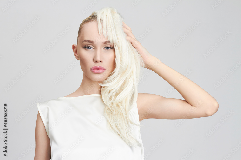 young woman with blonde wig. beautiful blond girl