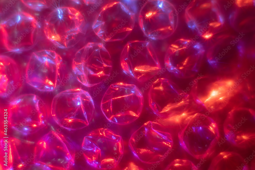 Abstract background with bubble wrap plastic film with soft focus color light. Abstract background with bubble wrap plastic film with soft focus color light.
