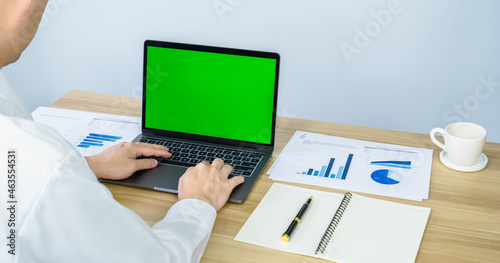 executive work with laptop and graph on working desk